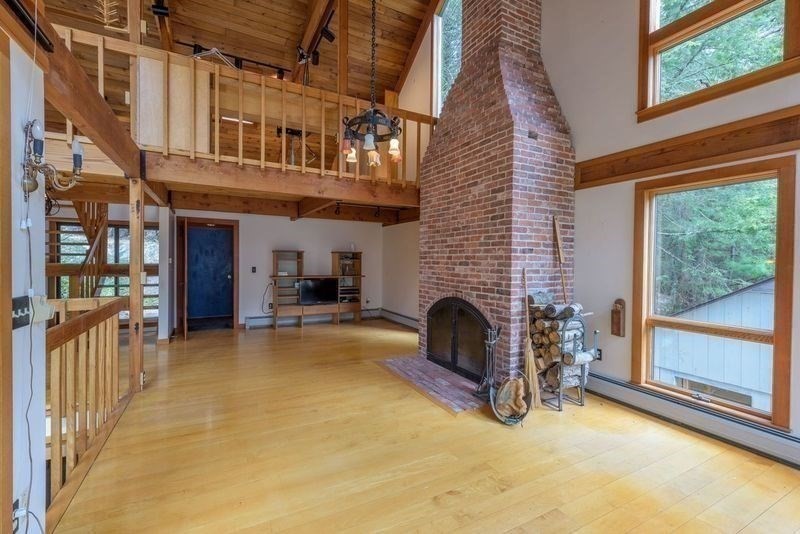 20 Lawton Road Leverett, MA 01054 - Photo 15 of 39 a view of a dinning room with furniture and a fireplace