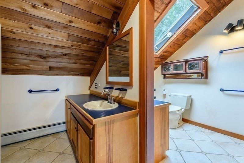 20 Lawton Road Leverett, MA 01054 - Photo 22 of 39 a bathroom with a sink and a mirror