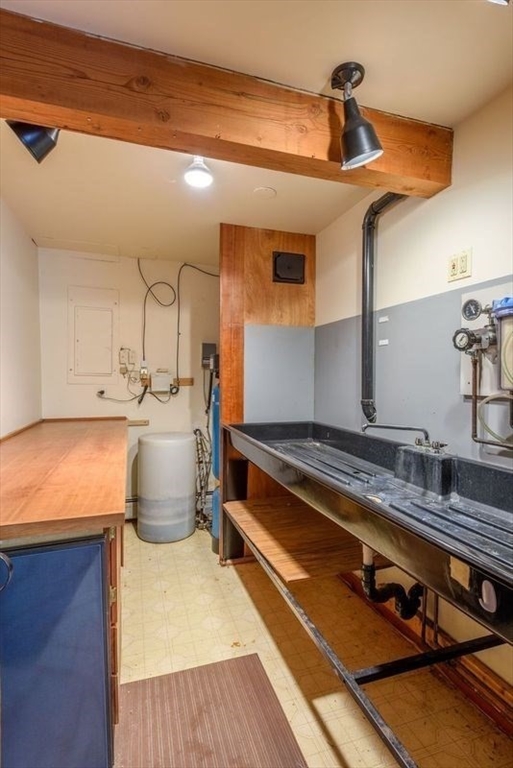 20 Lawton Road Leverett, MA 01054 - Photo 36 of 39 a kitchen with sink a stove and cabinets