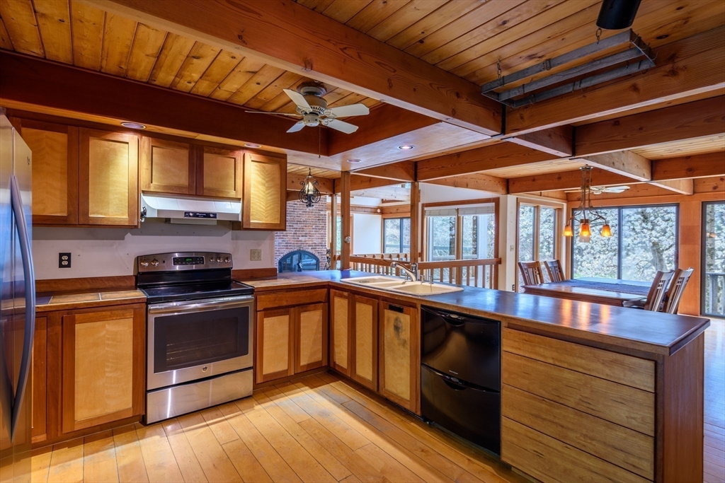 20 Lawton Road Leverett, MA 01054 - Photo 8 of 39 a kitchen with stainless steel appliances granite countertop a stove and a sink