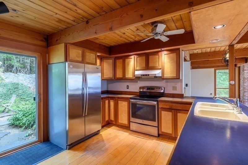 20 Lawton Road Leverett, MA 01054 - Photo 9 of 39 a kitchen with stainless steel appliances granite countertop a stove a sink and a refrigerator