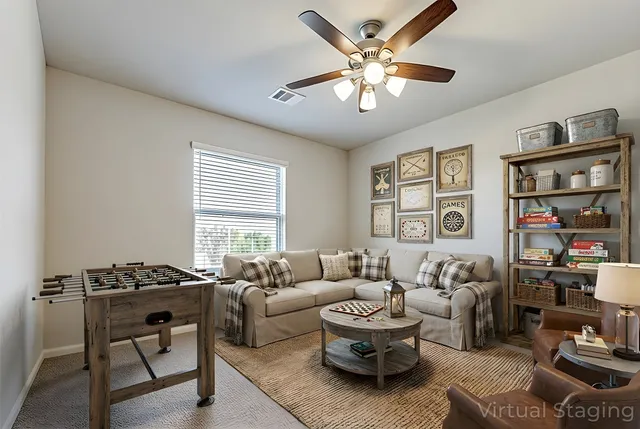 a living room with furniture and a window