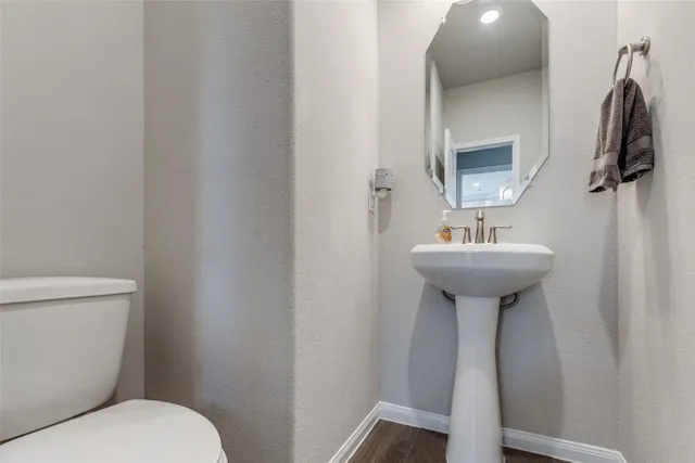 a bathroom with a sink toilet