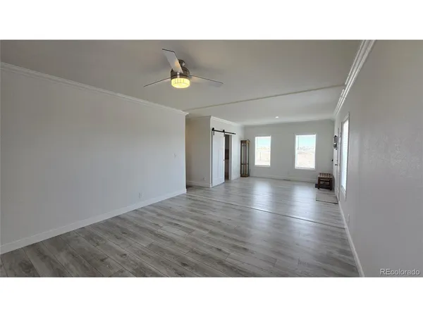a kitchen with granite countertop a sink cabinets and stainless steel appliances