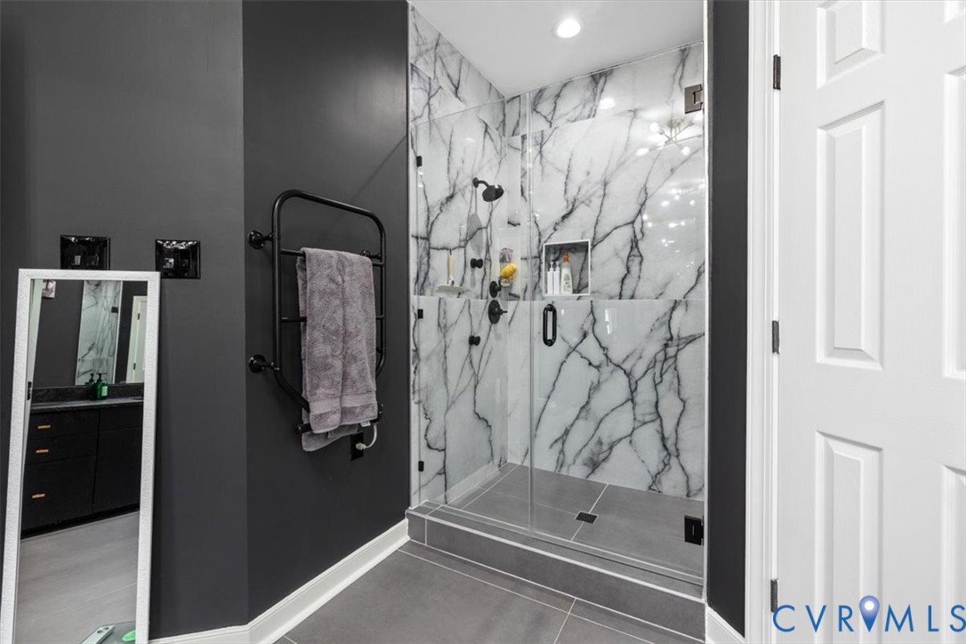 402 Rivers Bend Circle Chester, VA 23836 - Photo 48 of 80 a bathroom with a shower and a glass door