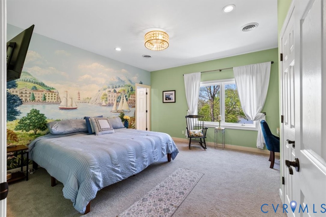 402 Rivers Bend Circle Chester, VA 23836 - Photo 57 of 80 a bedroom with a bed and a large window