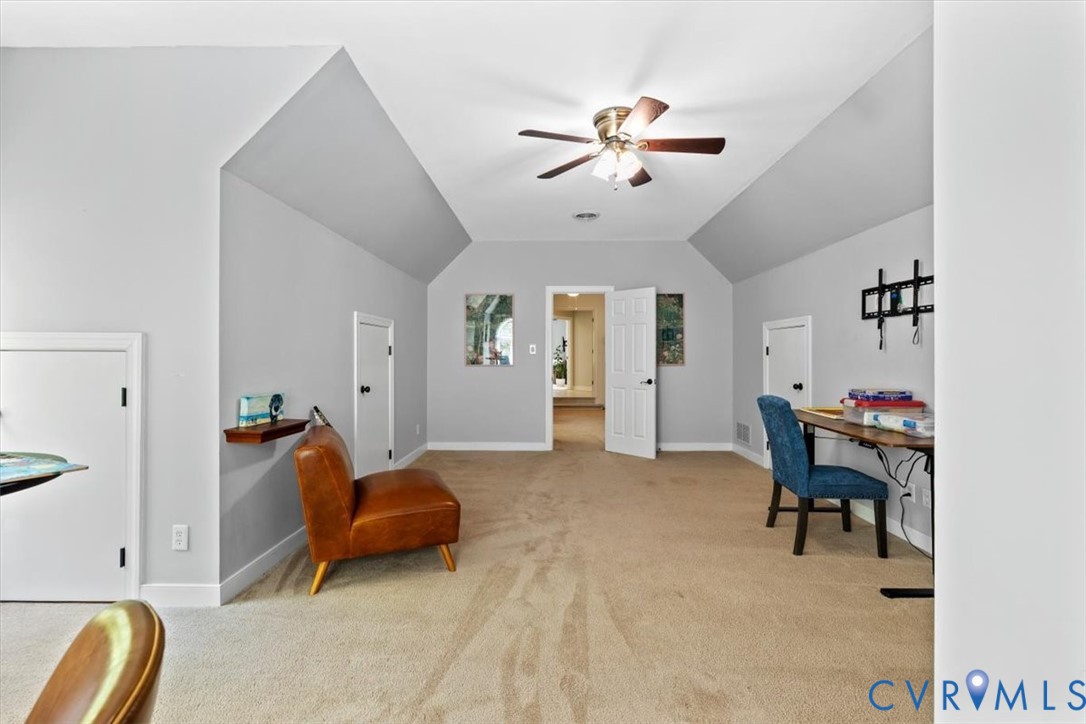 402 Rivers Bend Circle Chester, VA 23836 - Photo 60 of 80 a living room with furniture and a chandelier