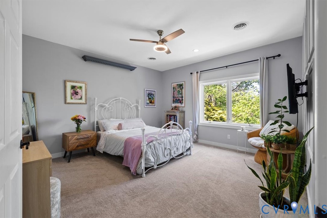 402 Rivers Bend Circle Chester, VA 23836 - Photo 64 of 80 a bed room with a bed and a window