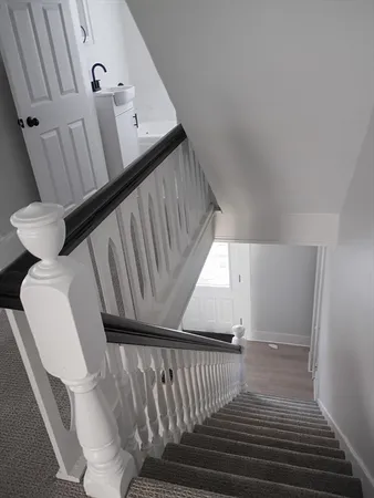 a bathroom with a tub and a window