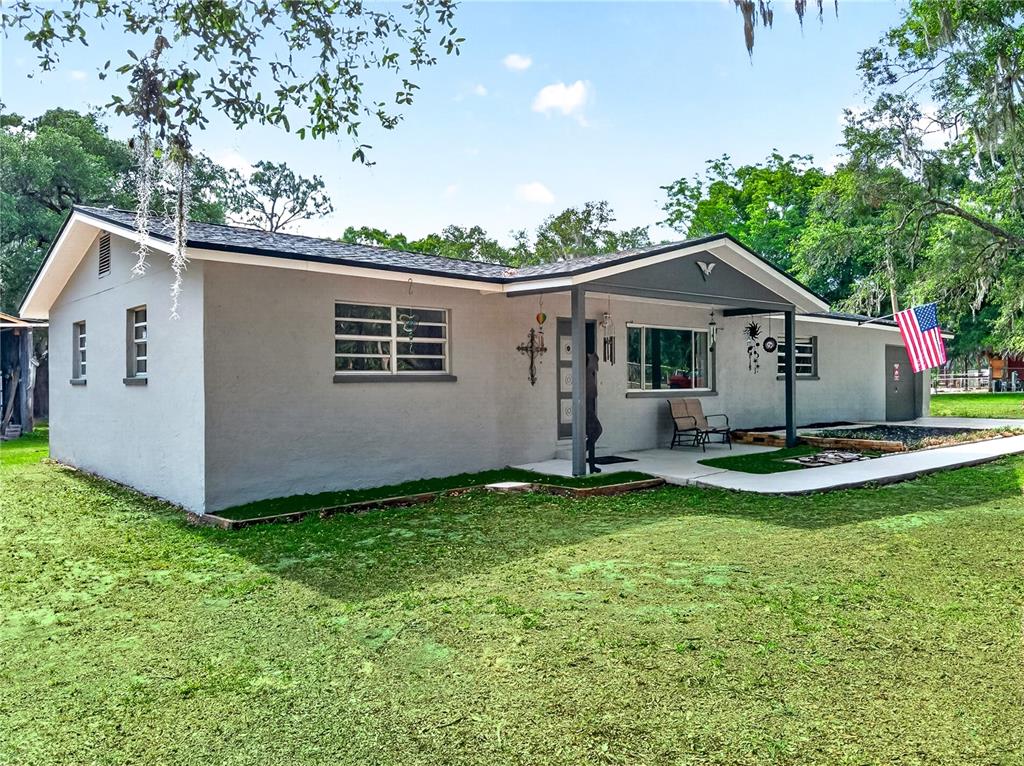5304 Tillman Road Lakeland, FL 33810 - Photo 1 of 33 a view of a house with a yard and sitting area