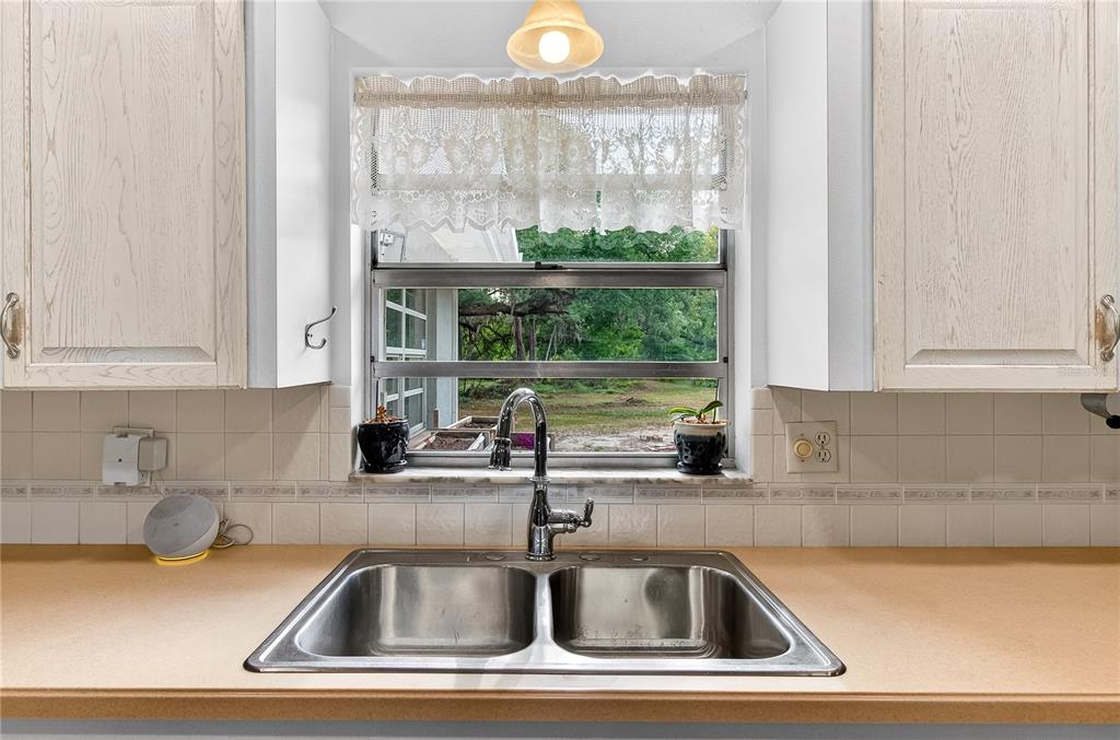 5304 Tillman Road Lakeland, FL 33810 - Photo 12 of 33 a kitchen with a sink and large window