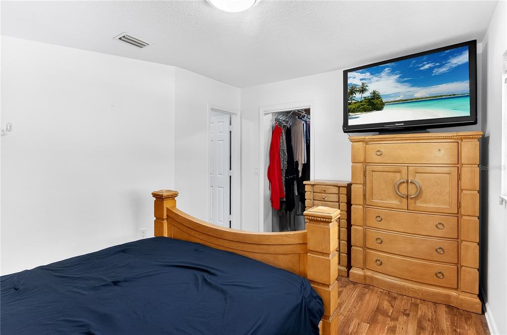 5304 Tillman Road Lakeland, FL 33810 - Photo 17 of 33 a bedroom with a bed and a flat screen tv