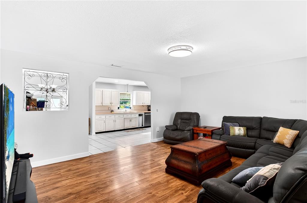 5304 Tillman Road Lakeland, FL 33810 - Photo 5 of 33 a living room with furniture and a wooden floor