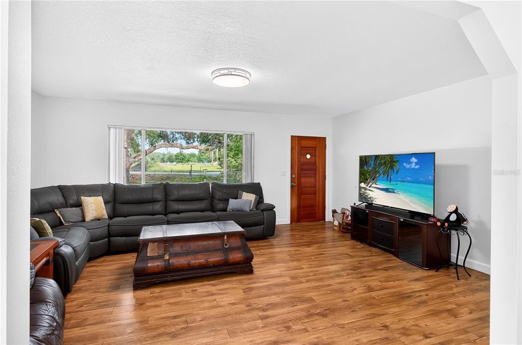 5304 Tillman Road Lakeland, FL 33810 - Photo 7 of 33 a living room with furniture and a flat screen tv