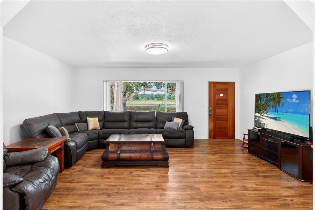 5304 Tillman Road Lakeland, FL 33810 - Photo 8 of 33 a living room with furniture and a flat screen tv