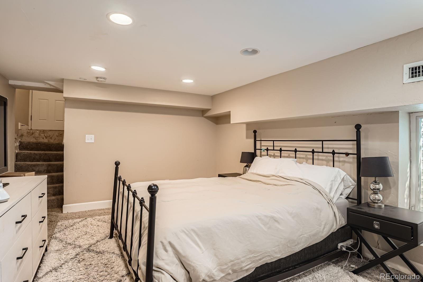 2838 Decatur Street Denver, CO 80211 - Photo 21 of 31 a bedroom with double bed and a window