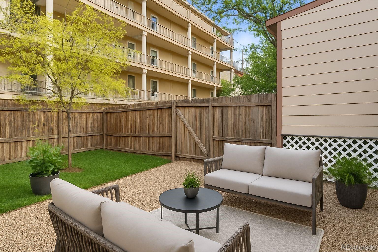 2838 Decatur Street Denver, CO 80211 - Photo 26 of 31 a view of a patio with couches table and chairs and potted plants