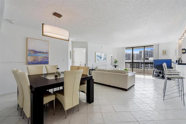 a view of swimming pool with outdoor seating and city view
