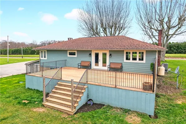 a view of a grassy field with trees