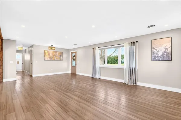 a kitchen with a table chairs stove and cabinets