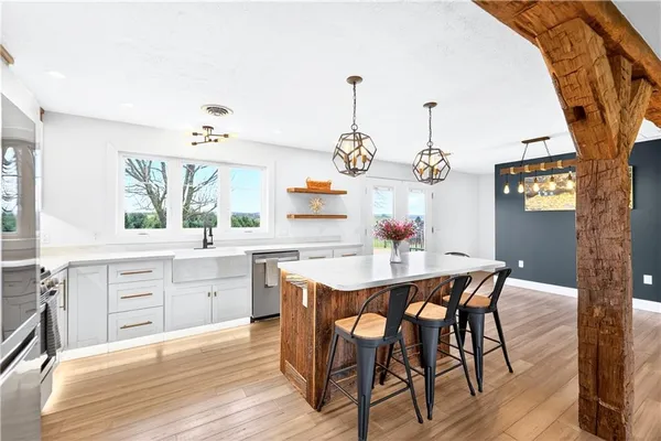 a view of a dining room with furniture window and wooden floor
