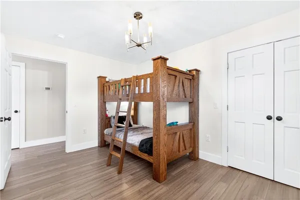 a bathroom with a sink a mirror and shower