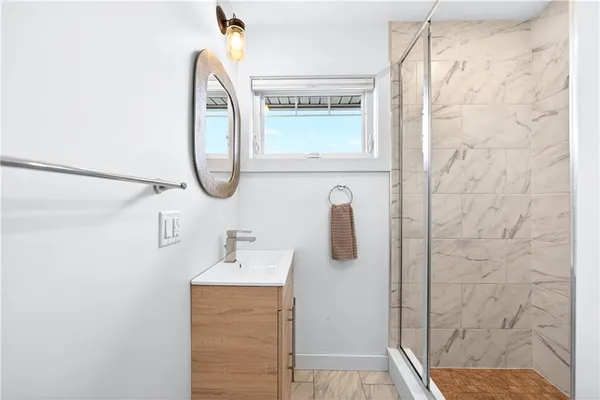 a bedroom with a bunk bed and a window