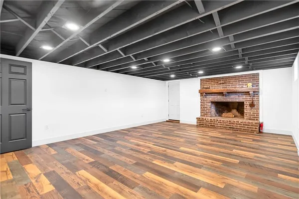 a view of fireplace and wooden floor