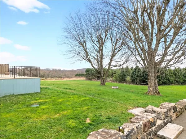 a view of a balcony with wooden floor