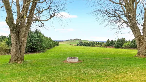 a house view with a sitting space and garden