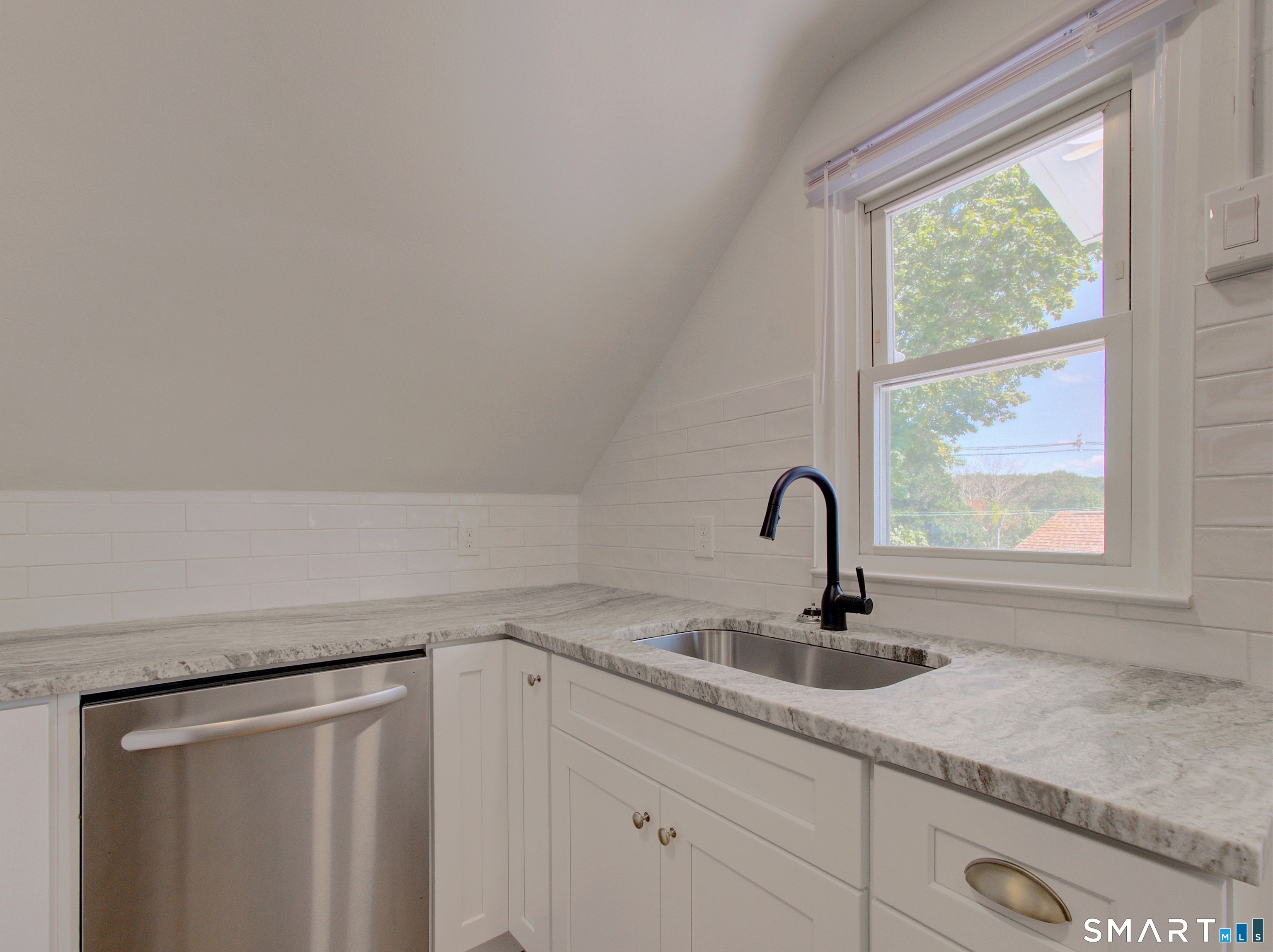16 Benham Road, Unit D Groton, CT 06340 - Photo 8 of 15 a sink with a close view of sink and tap