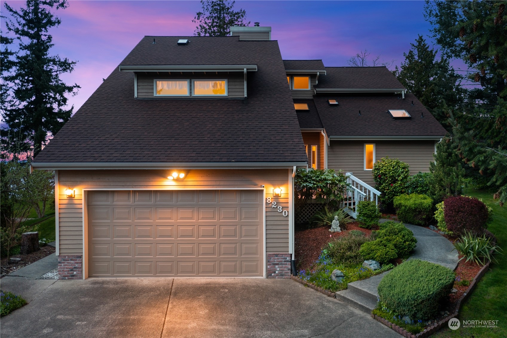a front view of a house with a garage