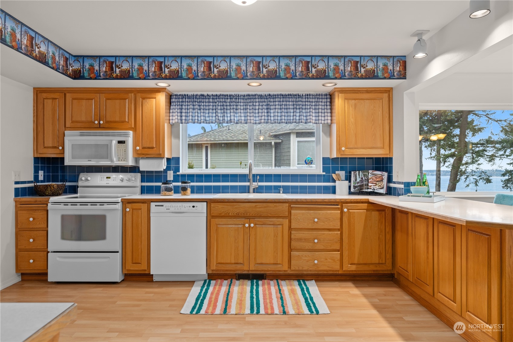 8230 Shoemaker Road Marysville, WA 98271 - Photo 11 of 40 a kitchen with stainless steel appliances granite countertop a sink and cabinets