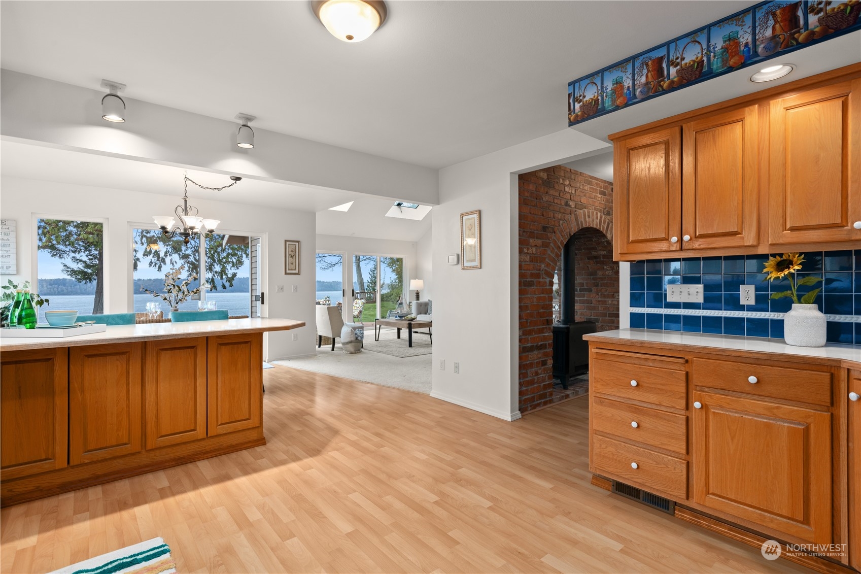 8230 Shoemaker Road Marysville, WA 98271 - Photo 12 of 40 a kitchen with stainless steel appliances granite countertop a refrigerator a stove a sink dishwasher and wooden cabinets with wooden floor