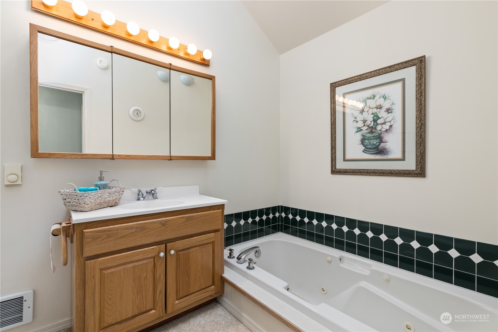 8230 Shoemaker Road Marysville, WA 98271 - Photo 15 of 40 a bathroom with a bathtub a sink and a window