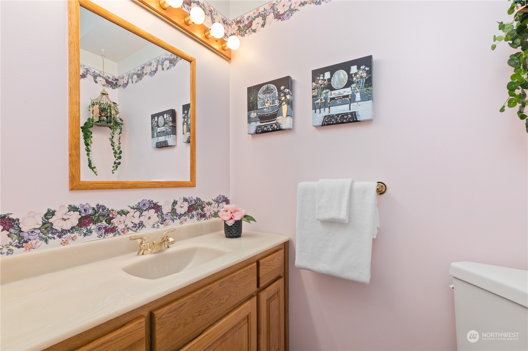 8230 Shoemaker Road Marysville, WA 98271 - Photo 16 of 40 a bathroom with a sink and a mirror