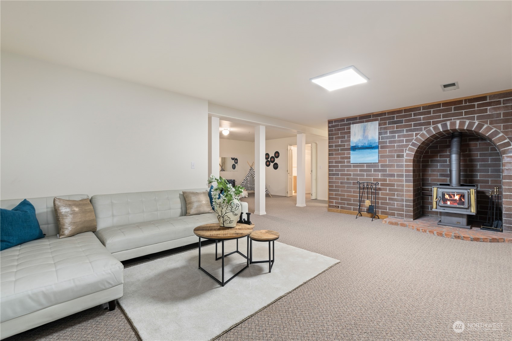8230 Shoemaker Road Marysville, WA 98271 - Photo 24 of 40 a living room with furniture and a fireplace