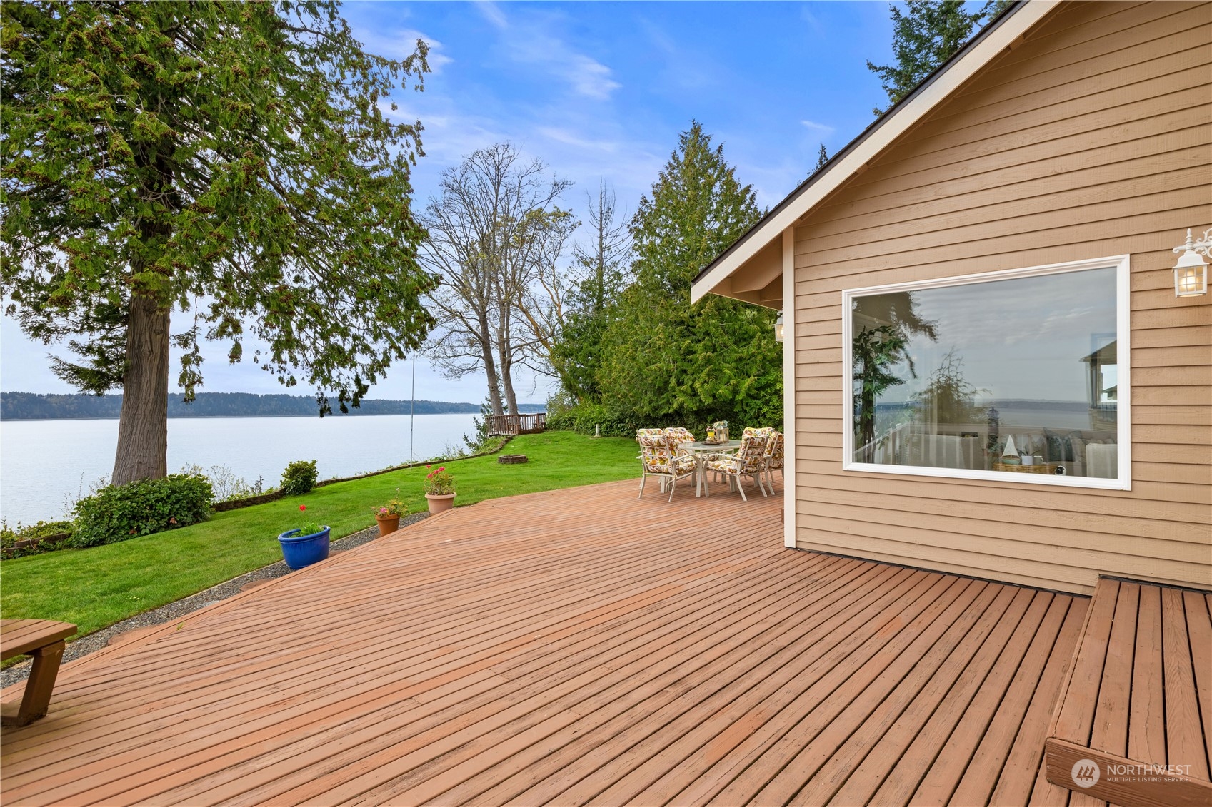 8230 Shoemaker Road Marysville, WA 98271 - Photo 29 of 40 a view of a patio with a table and chairs next to a yard