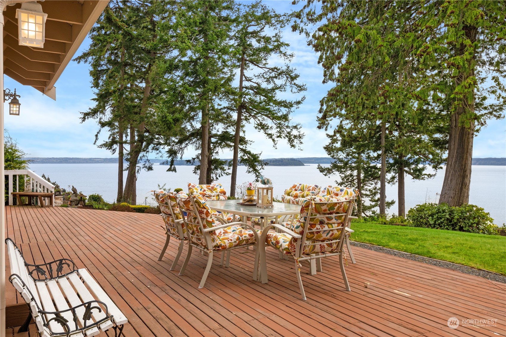 8230 Shoemaker Road Marysville, WA 98271 - Photo 31 of 40 a view of a patio with table and chairs with wooden floor and fence