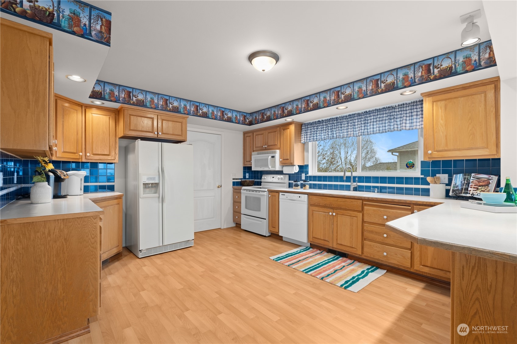 8230 Shoemaker Road Marysville, WA 98271 - Photo 10 of 40 a kitchen with stainless steel appliances granite countertop a refrigerator and a sink