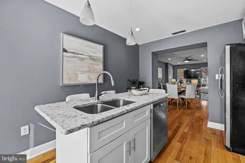a kitchen with sink and stove