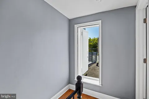 a view of a hallway with windows