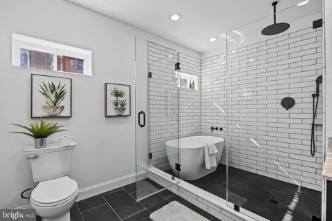 a bathroom with a sink a bathtub and a shower