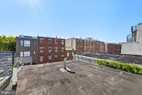 a view of a street with cars
