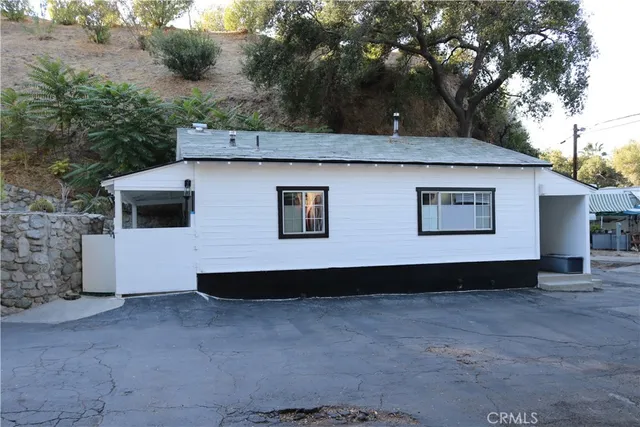 a house that has a tree in the background