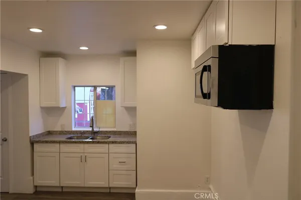 a kitchen with stainless steel appliances a refrigerator and a stove