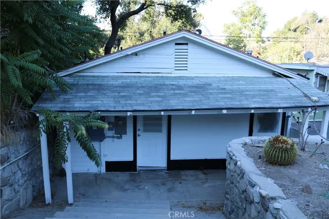 a front view of a house with garage