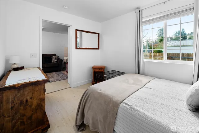 a bedroom with a bed and a couch