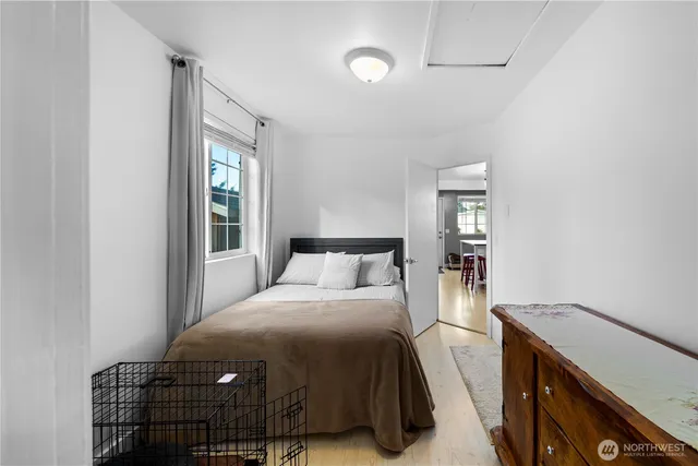 a bedroom with a bed and a window