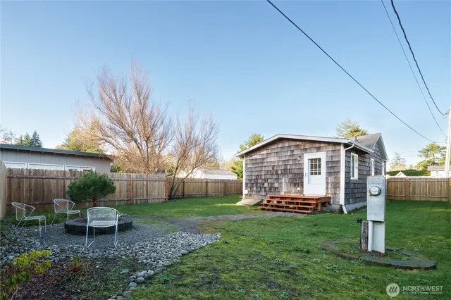 a view of a house with backyard and a slide